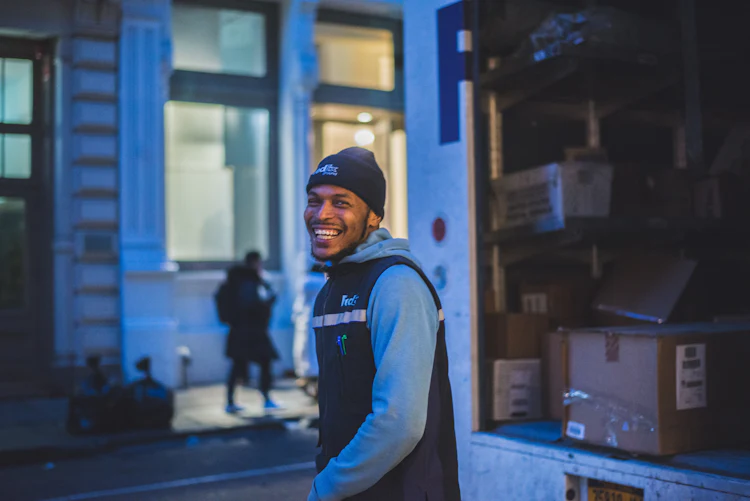 Smiling driver next to his truck