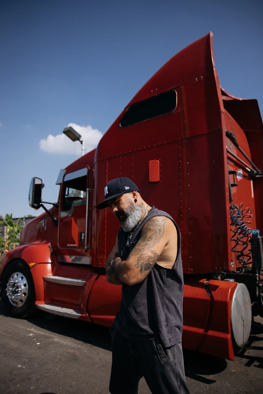 Driver standing by his semi truck